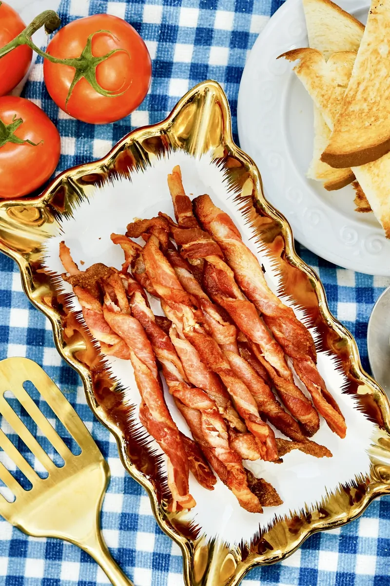 Air fryer bacon twists served with toast and eggs on breakfast table