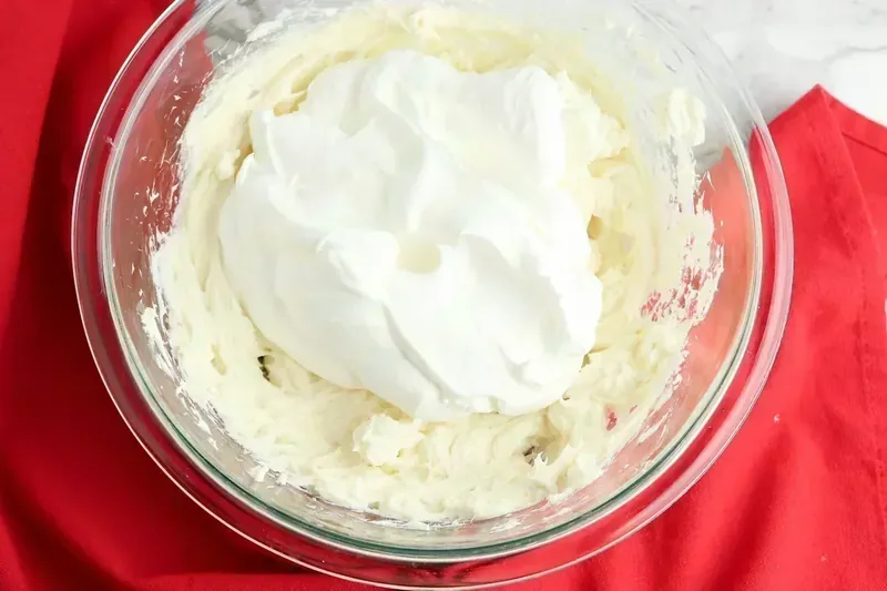 Smooth and creamy cheesecake filling with whipped topping folded in