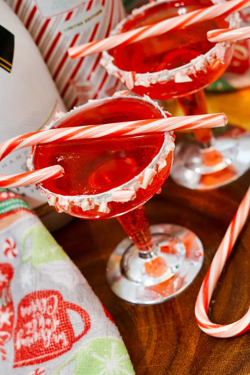 Close up of candy cane mimosa showing detailed rim and red cocktail color