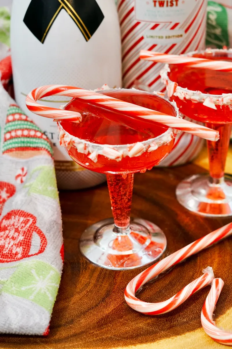 Single candy cane mimosa with perfect candy cane stirrer garnish