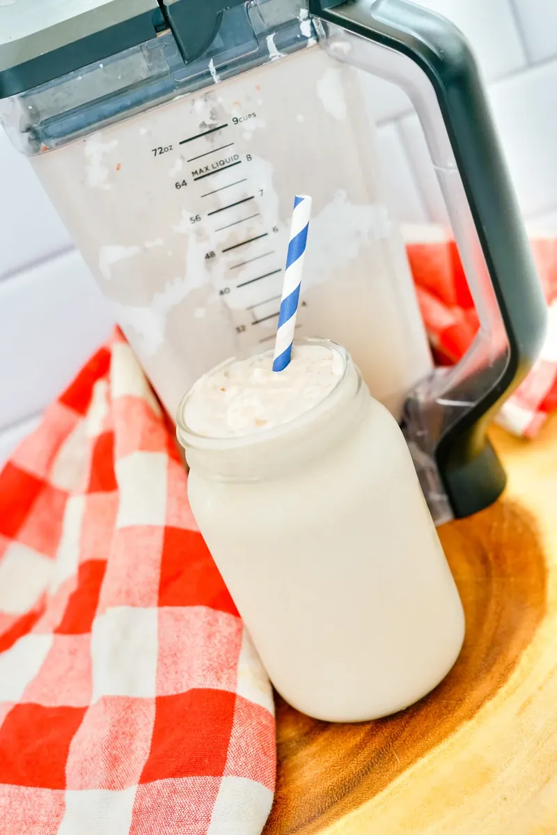 Homemade copycat Wendy's Frosty in glass with striped straw