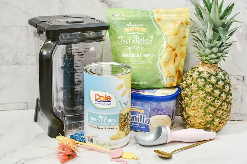Ingredients for Disney Dole Whip recipe including frozen pineapple, pineapple juice and vanilla ice cream
