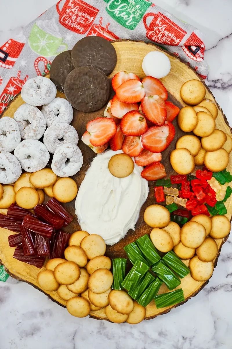 Completed gnome frosting board viewed from above showing full arrangement of treats and gnome design