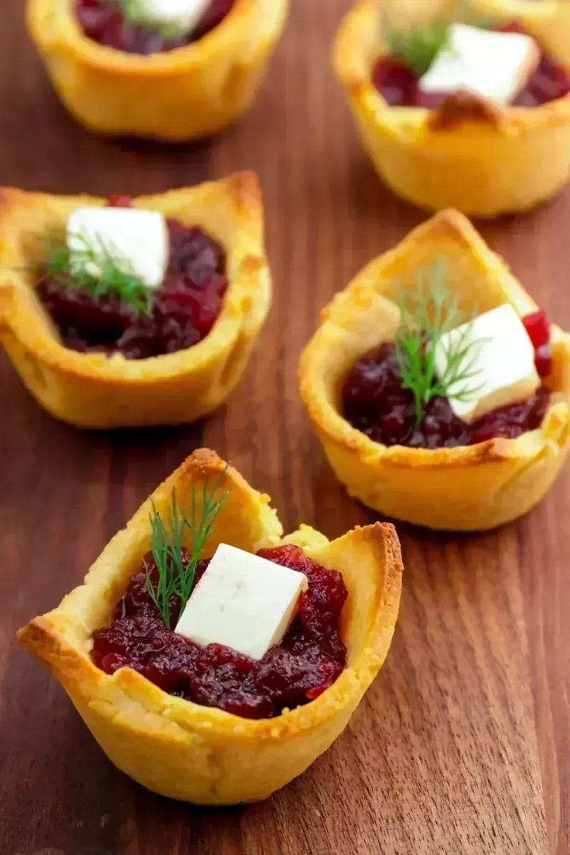 Keto cranberry brie bites arranged as elegant appetizer spread