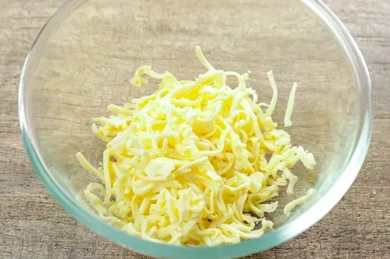 Melted mozzarella cheese in glass bowl for keto cranberry brie bites