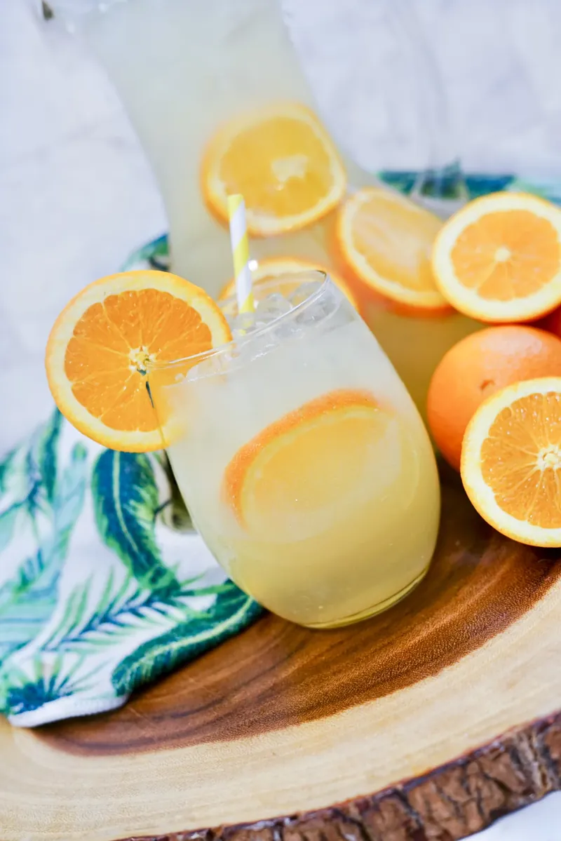 Mimosa sangria glasses with tropical leaf napkin