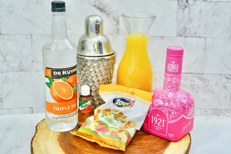 Tequila, triple sec, peach juice, Tajin and peach rings ingredients for margarita shooters