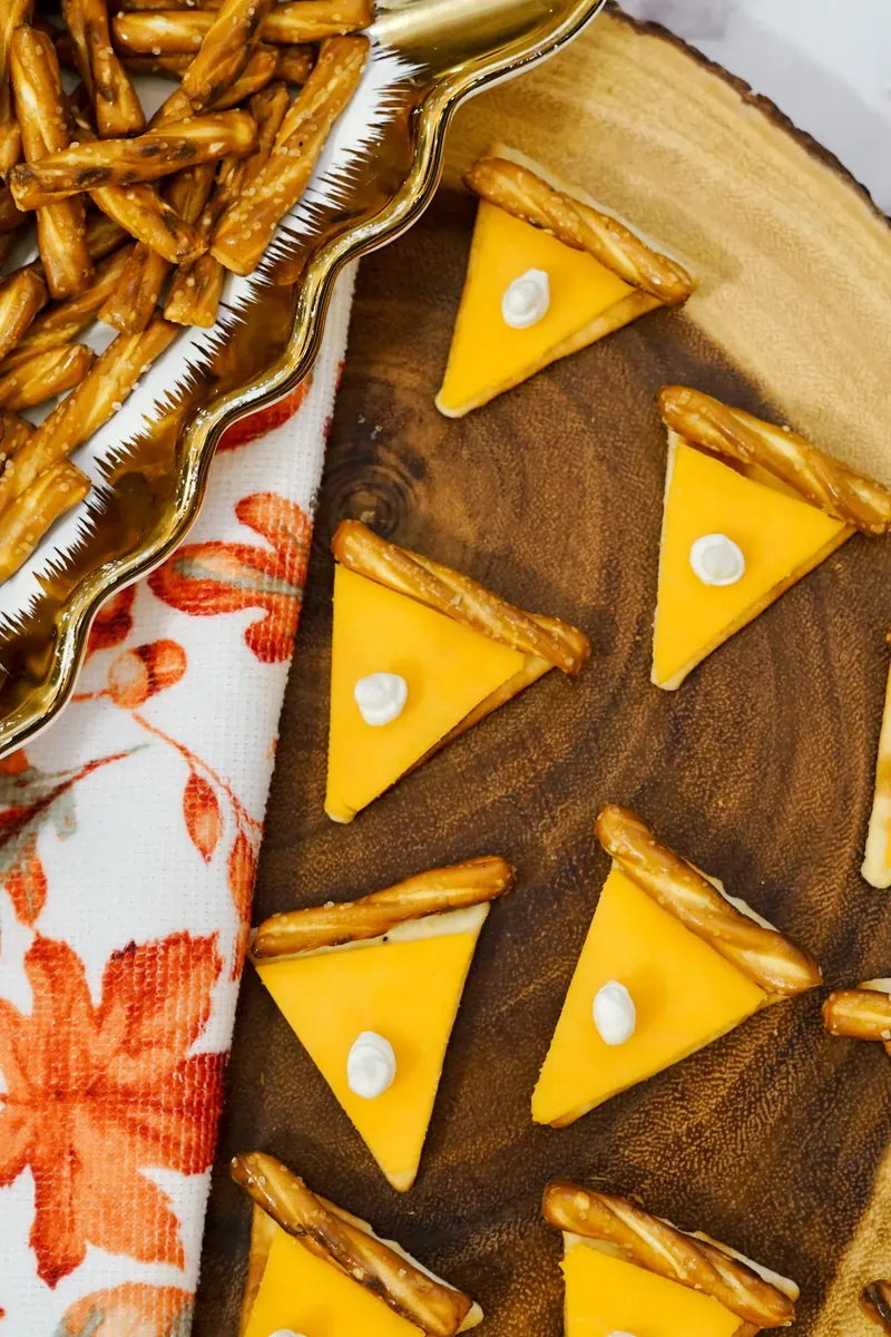 Close up detail of pie cheese crackers with cream cheese whipped cream dots