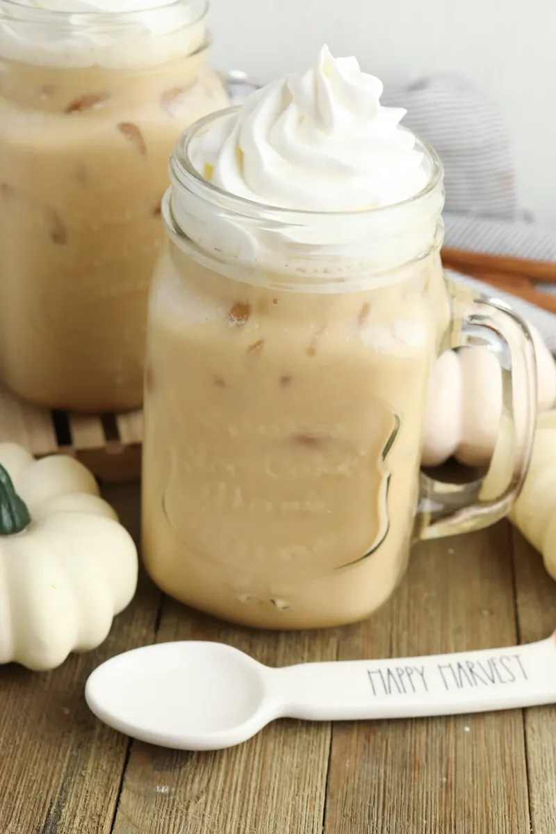 Pumpkin sweet cream cold brew in mason jar mug with whipped cream