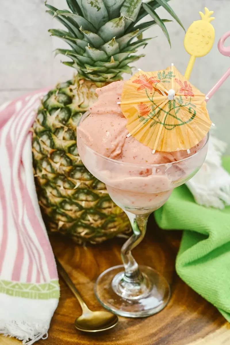 Strawberry dole whip with summer styling and tropical decorations