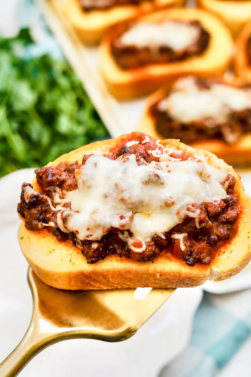 Close up of Texas Toast Sloppy Joe showing melted cheese and meat