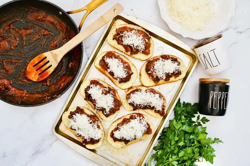 Texas toast sloppy joes topped with shredded mozzarella cheese
