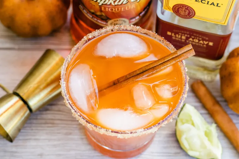 Finished thanksgiving margarita with cinnamon stick garnish