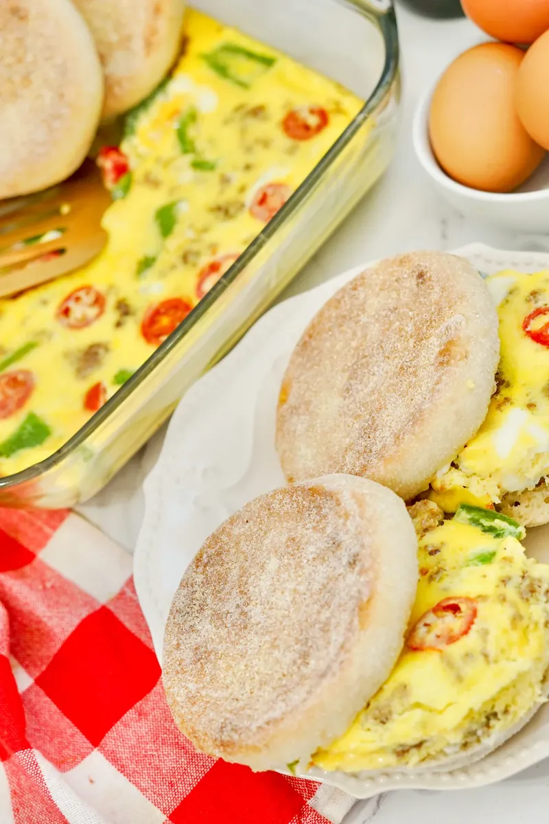 Breakfast sandwiches showing perfect egg portions cut from baked dish