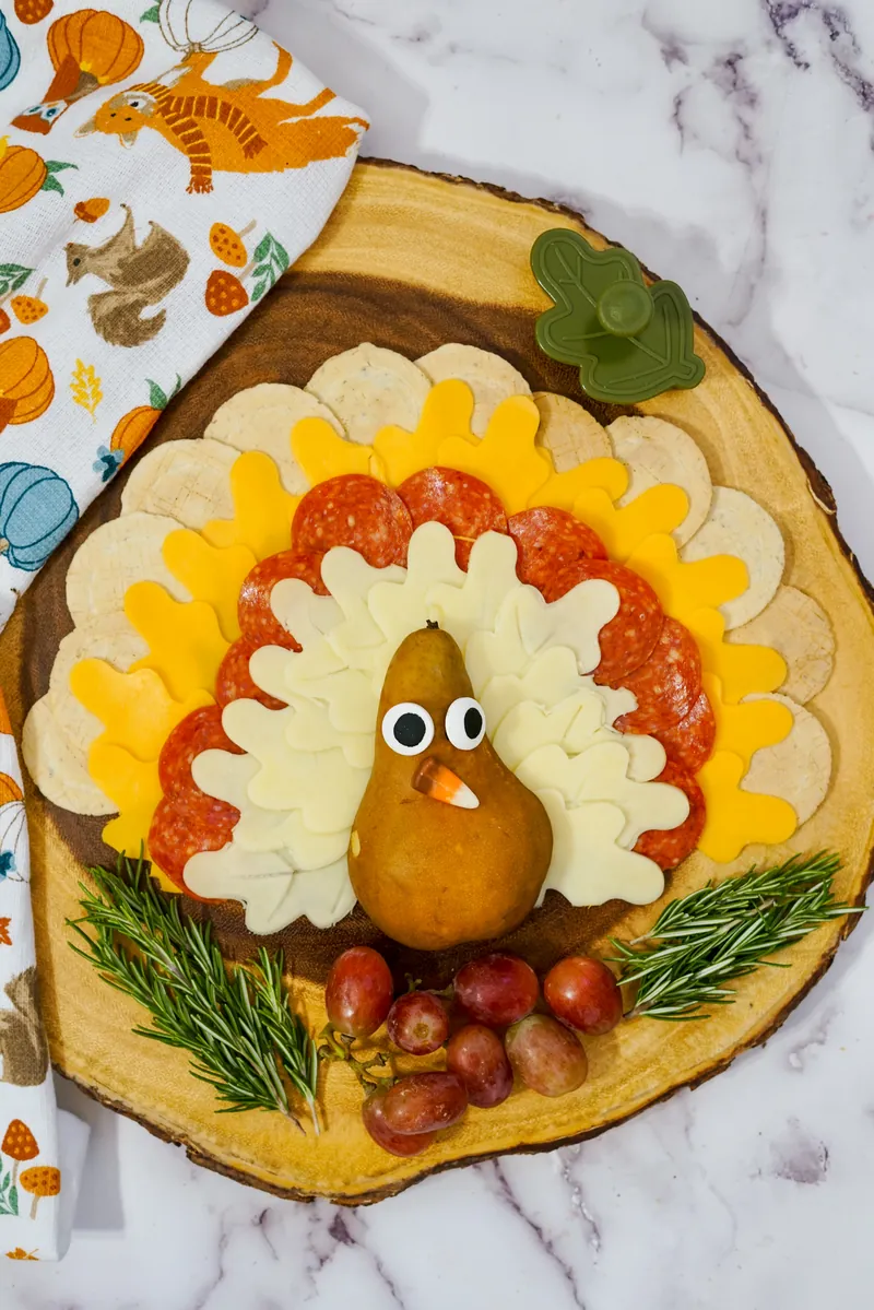 Finished turkey cheese plate with festive autumn napkin, perfect Thanksgiving appetizer