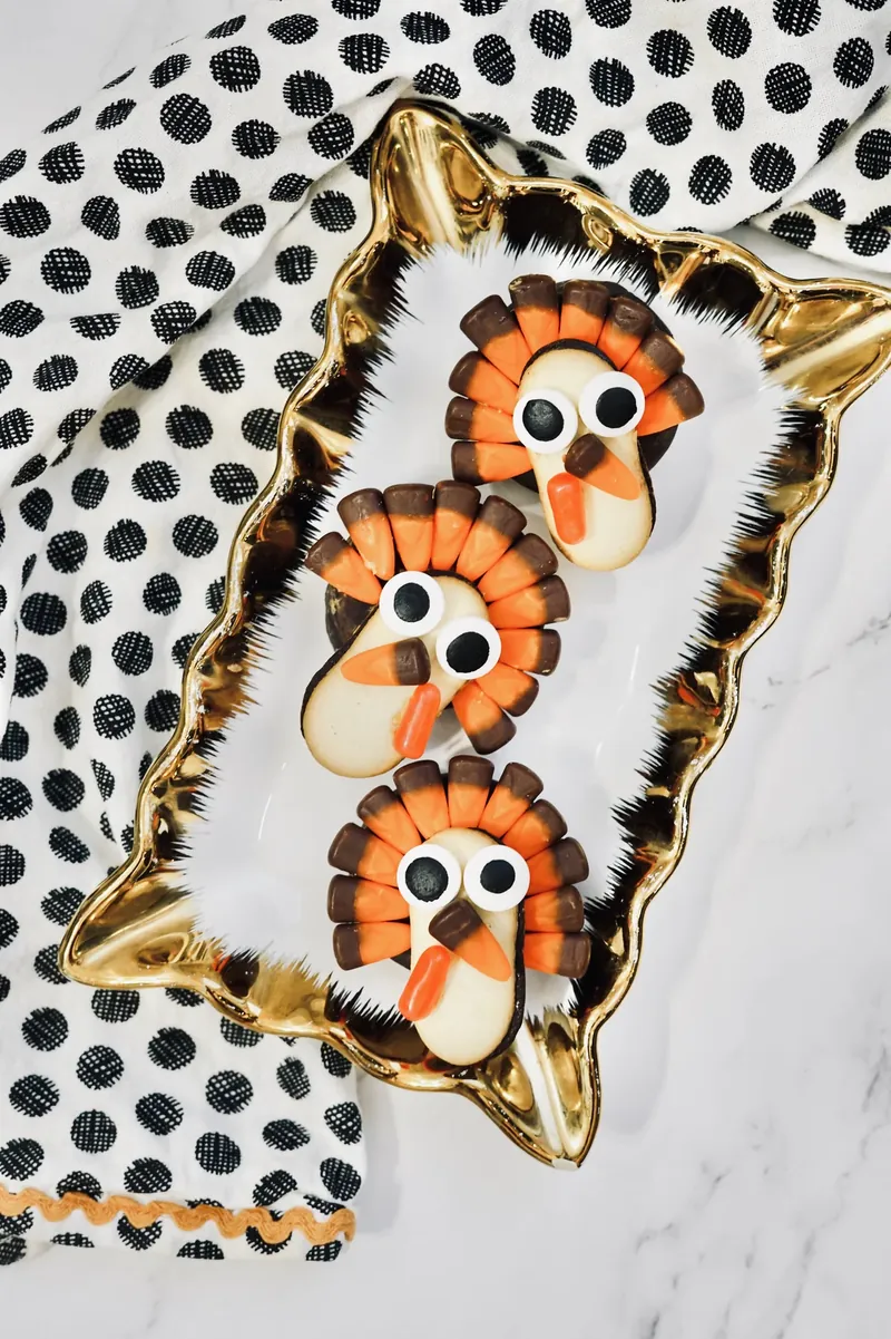 Turkey treats arranged on decorative gold platter with festive napkin