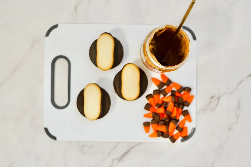 Milano cookies attached to Moon Pies with candy corn arranged as turkey feathers