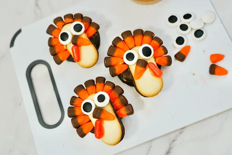 Completed turkey treats with candy corn beaks and red Mike and Ike wattles