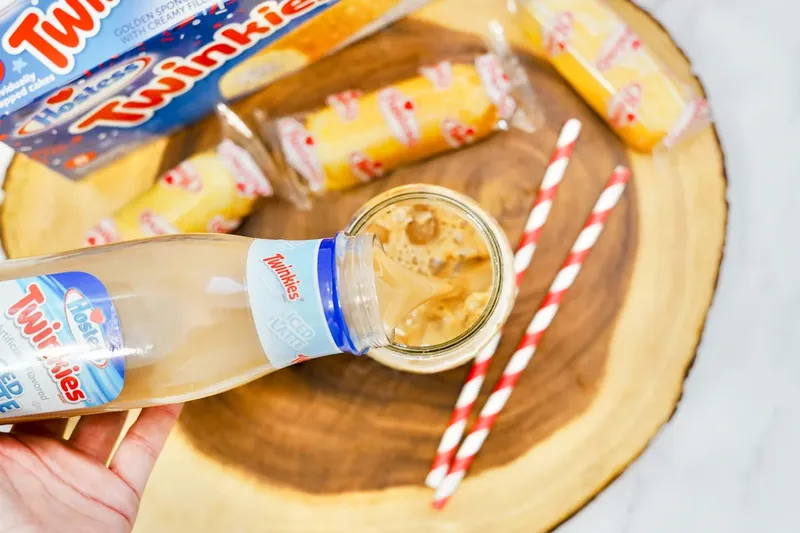 Twinkie iced latte being poured into ice-filled mason jar