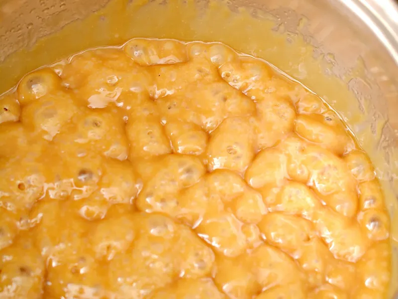 Bubbling toffee mixture with butter and brown sugar substitute in saucepan