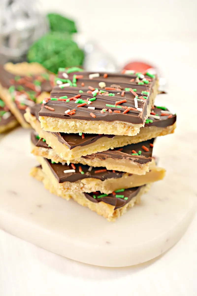 Stack of keto Christmas crack pieces showing toffee and chocolate layers