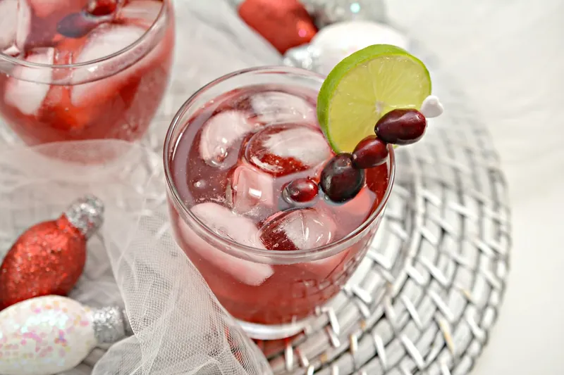 Two glasses filled with ice ready for keto Christmas margarita