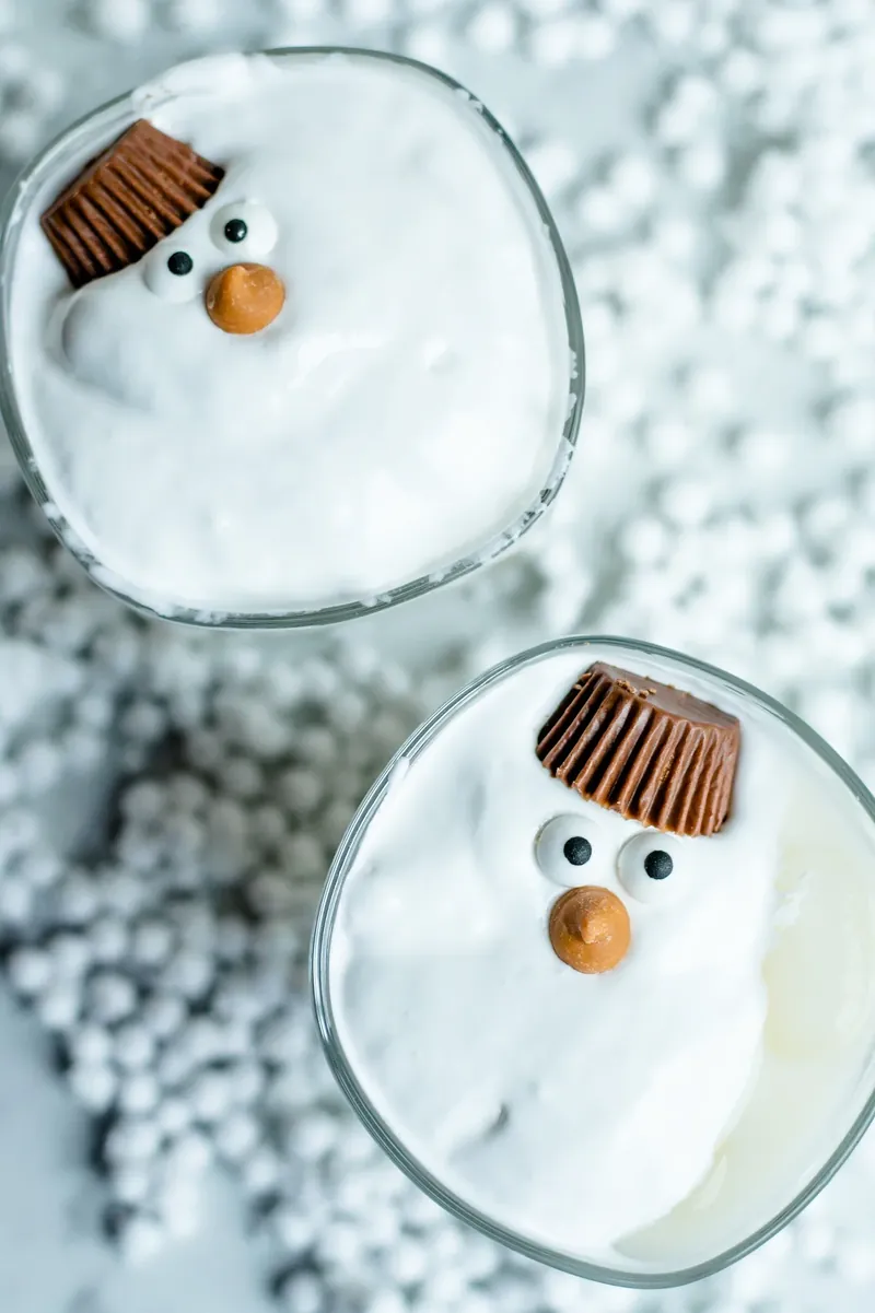 Finished melted snowman margaritas displayed together showing holiday cocktail presentation