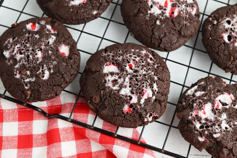Peppermint chocolate cookies baking in oven until edges are set