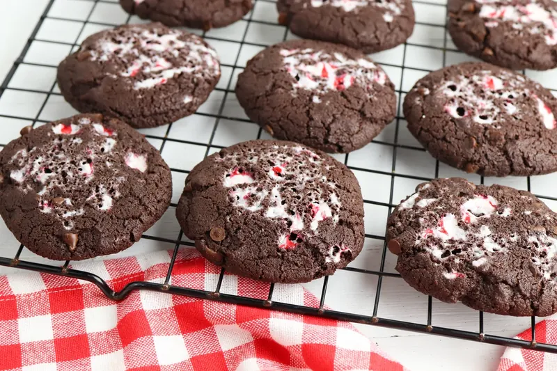 Freshly baked peppermint chocolate cookies cooling on wire rack
