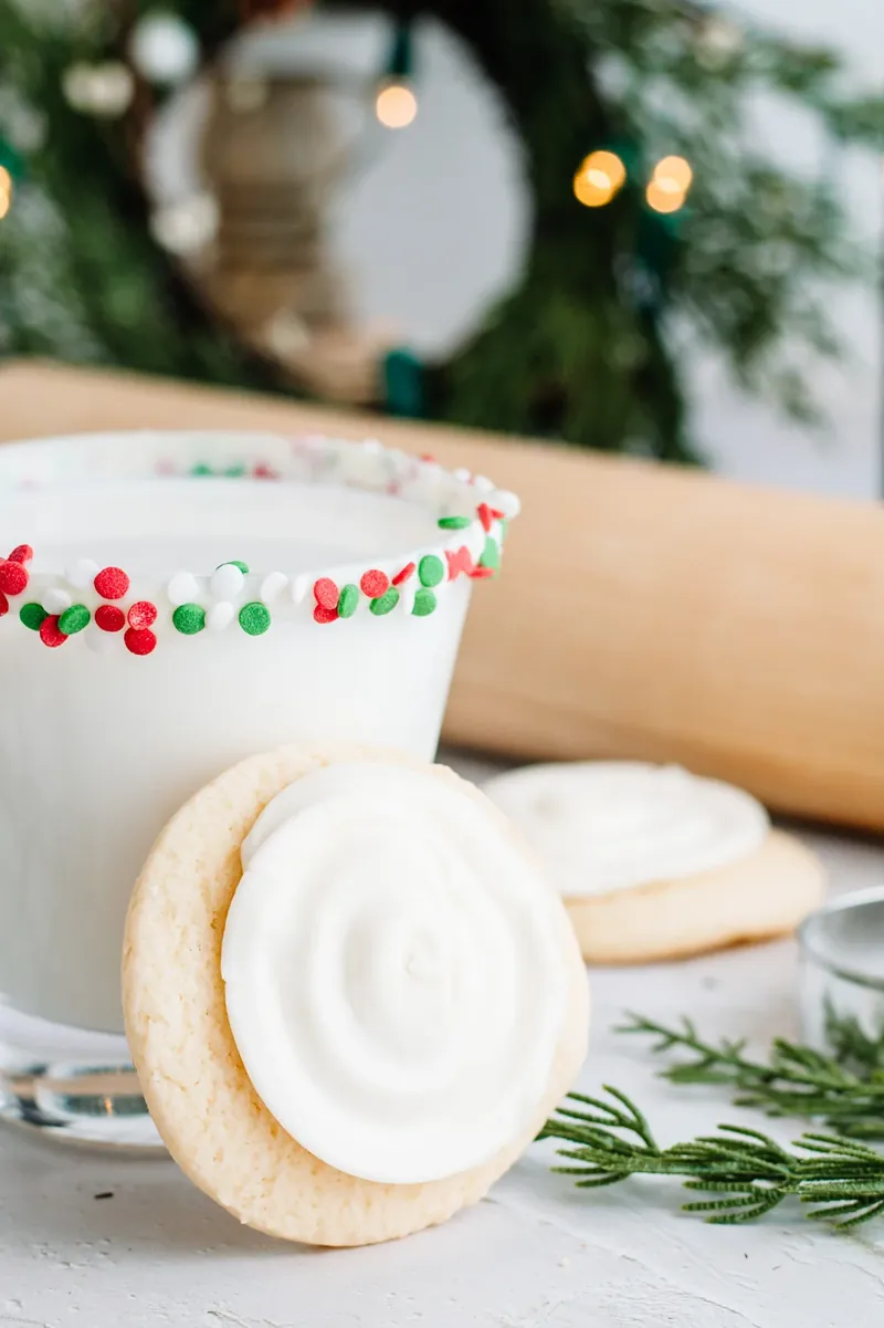 Sugar cookie margarita in holiday setting with Christmas lights and sugar cookies