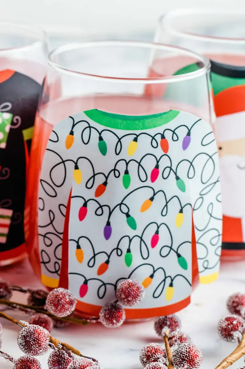 Christmas light sweater design glass filled with pink margarita punch