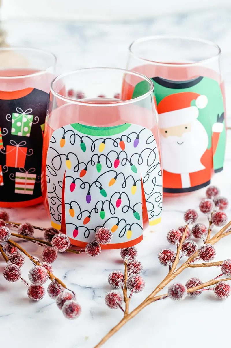 Multiple glasses of Ugly Christmas Sweater Margarita Punch with different sweater designs