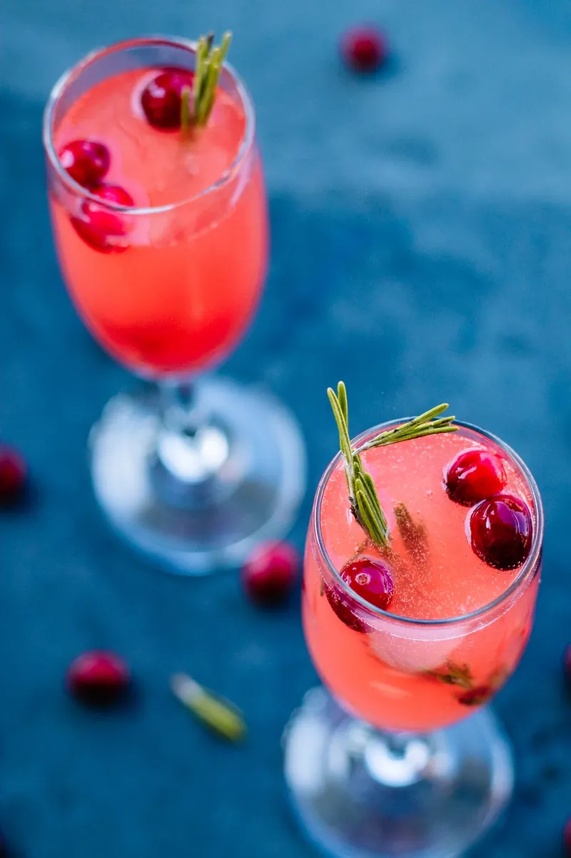 Overhead view of vanilla cranberry mimosa with cranberry garnish