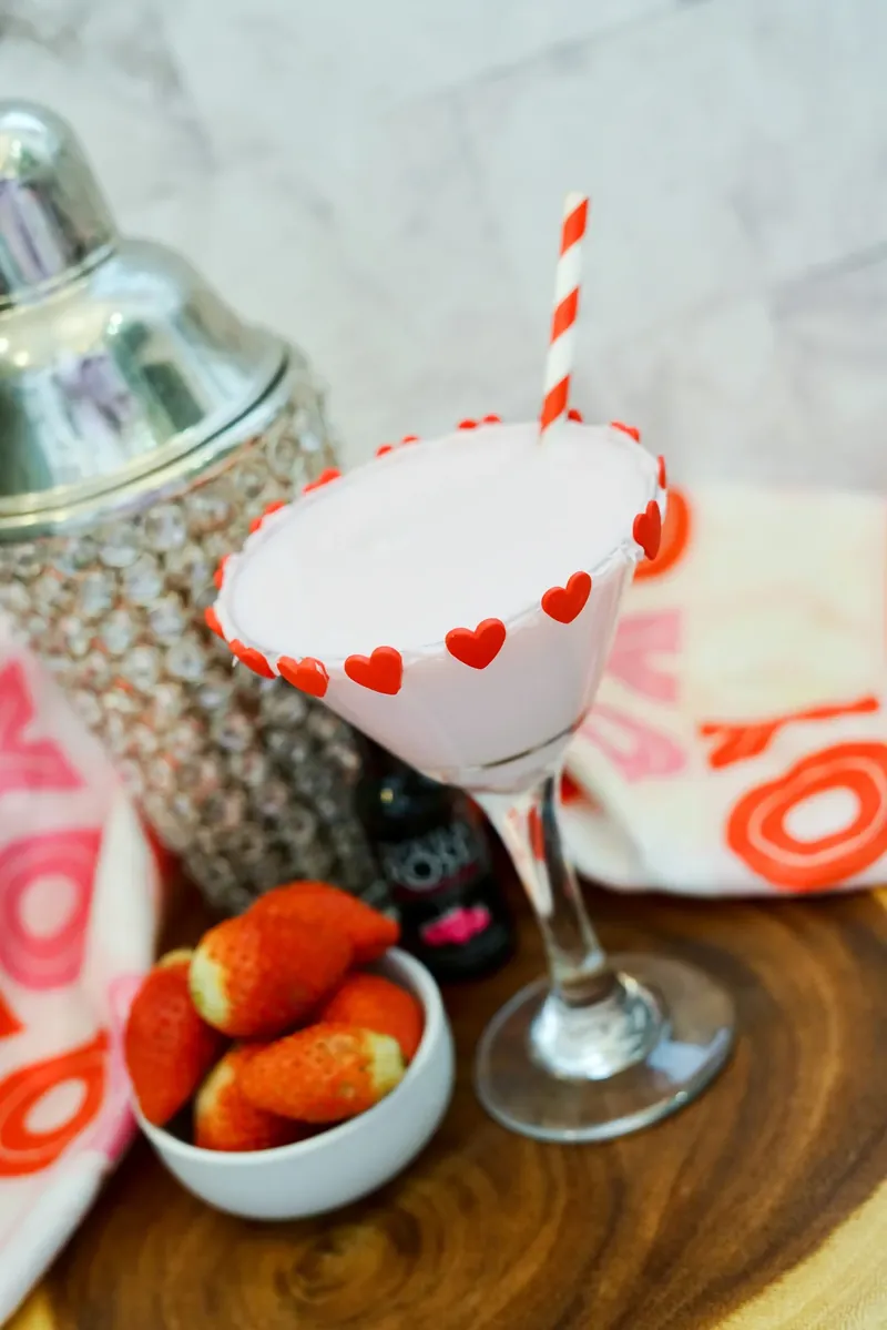 Completed Valentine's chocolate strawberry martini with heart rim and fresh strawberries